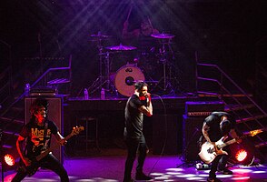 The Dead Rabbitts performing live in 2014. From left to right: TJ Bell, Rob Pierce (above), Craig Mabbitt (below) and Alex Torres.