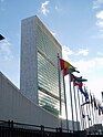 United Nations headquarters building, with flags in foreground