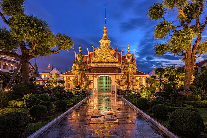 Two sculptures guarding the eastern gate to the main chapel of Wat Arun in the Bangkok Yai District, Thailand Photograph: BerryJ