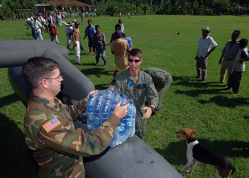 File:US Navy 051016-N-5526M-029 U.S. Army Warrant Officer Jeremy Bennett and Specialist Ryan Becker unload food, water, and medicine from a U.S. Army UH-60 Blackhawk helicopter during relief efforts for victims of Hurricane Stan.jpg