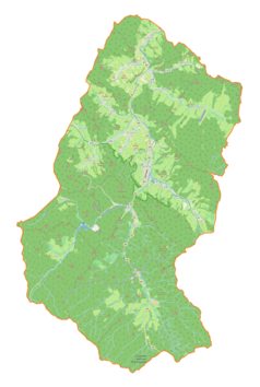 Mapa konturowa gminy Baligród, blisko centrum na dole znajduje się punkt z opisem „Łubne”