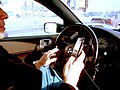 Image 60A driver using two handheld mobile phones at once (from Mobile phone)