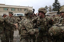 US Army troops react to winning tug of war competition.jpg