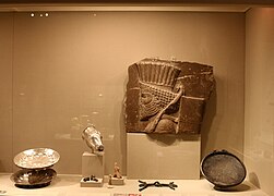 Museum display case showing Achaemenid objects.