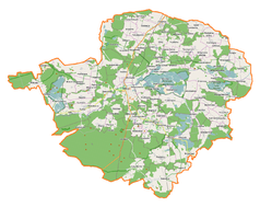 Mapa konturowa powiatu milickiego, u góry nieco na prawo znajduje się punkt z opisem „Trzebicko”