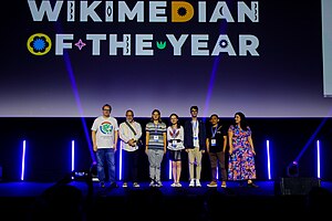 Awardees of the Wikimedian of the Year 2024 on stage with Jimmy Wales