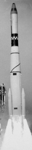 Rocket with a pair of small boosters at the side taking off