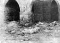 Armenian monastery in Bitlis with severed heads and corpses in the foreground.