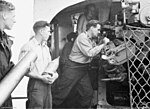 Thumbnail for File:Gunners loading 4.7 inch gun HMAS Bataan 1952 AWM P00444.jpeg