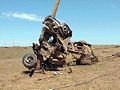 A truck wrapped around a telephone pole and pulverized.