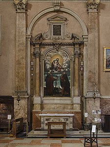 First altar on the left, starting from the entrance