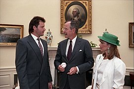 President George H. W. Bush meets with Roger Clemens and his wife in the Oval Office, and they exchange signed baseballs.jpg