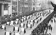 Women's suffragists parade in New York City in 1917, carrying placards with signatures of more than a million women.[154]