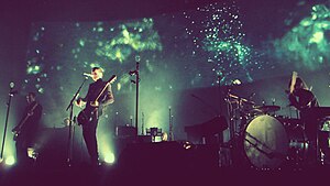 Sigur Rós performing in 2013. From left to right: Georg, Jónsi and Orri.