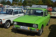 Post-1982 grille variant, missing the bright metallic outline around the edges. The logo itself has "AZLK" letters clearly outlined.