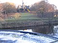 In the middle of this weir is a fish ladder, which allows trout and salmon to pass the weir to go upriver to spawn.