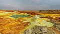 Image 14 Dallol Photograph credit: Alexander Savin Dallol is a cinder-cone volcano in the Danakil Depression, northeast of the Erta Ale Range in Ethiopia. The area lies up to 120 m (390 ft) below sea level, and has been repeatedly flooded in the past when waters from the Red Sea have inundated it. The Danakil Depression is one of the hottest places on Earth, and the evaporation of seawater after these flooding episodes produced thick deposits of salt, as seen in this landscape. The deposits at Dallol include significant quantities of the carbonate, sulfate and chloride salts of sodium, potassium, calcium and magnesium. Hot springs discharge brine to form the blueish ponds, and small, temporary geysers produce cones of salt. More selected pictures