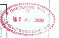 Exit stamp in an Indian passport issued at Indira Gandhi International Airport