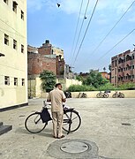 Postman with bicycle.jpg