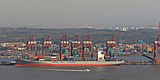 B8 A container ship at Jawaharlal Nehru Port, Mumbai. International trade accounted for 14% of India's GDP in 1988, 24% in 1998, and 53% in 2008.