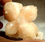 Intergrown pinkish stilbite crystals showing the "bow-tie" tendency from Jalgaon District, Maharashtra, India.