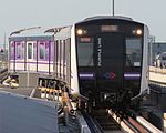 MRT Purple Line train entering a station.