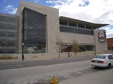 History of Colorado Center, an image of a brown building with a winged roof.