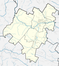 Mapa konturowa powiatu skarżyskiego, blisko centrum na prawo znajduje się punkt z opisem „Suchedniów”