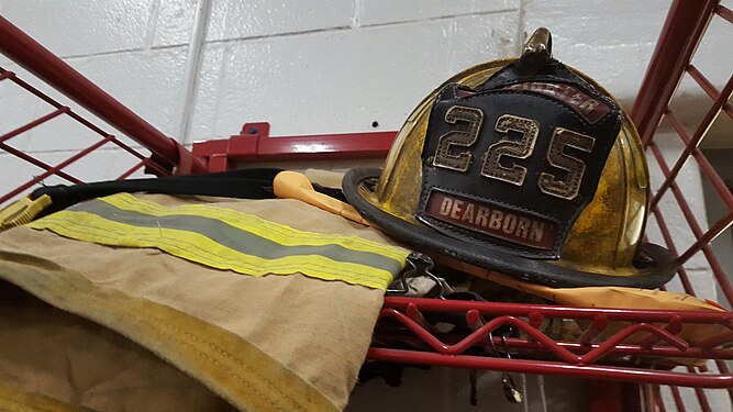 Well-used firefighter's helmet and turnout gear