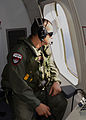 A US Navy airman scans the Southern Indian Oceans for any signs of Flight 370/Seorang askar udara Tentera Laut Amerika Syarikat mengimbas Laut India Selatan untuk sebarang tanda Penerbangan 370/一名美国海军飞行员正在南印度洋搜寻马航370的任何线索