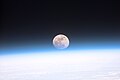 "Full_moon_partially_obscured_by_atmosphere.jpg" by User:Zarex