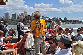 New York Water Taxi tourguide; Brooklyn Heights in background, 2013.