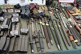 Victory Show Cosby UK 06-09-2015 WW2 re-enactment display Trade stalls Misc. militaria personal gear replicas reprod. originals collect. zaphad1 Flickr CCBY2.0 Ammo mags grease carabine AK47 UZI VIG Browning MG13 bayonets etc IMG 3830.jpg