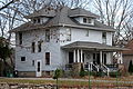 Image 11A wood-frame American Foursquare house in Minnesota with dormer windows on each side and a large front porch