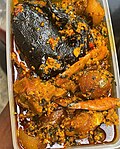 Thumbnail for File:Egusi soup with vegetables and dried catfish, prawns, beef and roasted cowskin.jpg