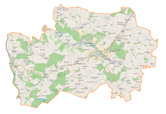 Mapa konturowa powiatu kraśnickiego, blisko lewej krawiędzi znajduje się punkt z opisem „Świeciechów Poduchowny”