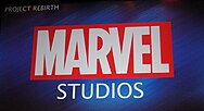 The "Marvel" logo on a blue background with "Studios" in white underneath and "Project Rebirth" in the top corner of the screen at D23 Expo.