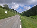 View on the last two kilometers of the Col de Peyresourde in the climb from Armenteule. On the left side of the road a mountain pass cycling milestone can be seen.