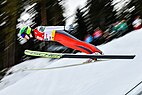 Ilkka Herola in the middle of a ski jump.