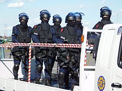 Anti-Firearms Squad of Japan armed with MP5 submachine guns. Some are equipped with Brügger & Thomet Foldable Visor Helmet Stocks.