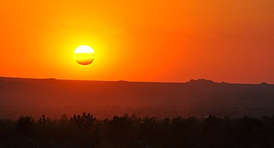 Sun setting through layers of haze