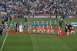 Community Shield 14 - Managers lead the teams out (14698393168).jpg