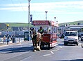 A horse tram passes a pedestrian crossing on Douglas promenade