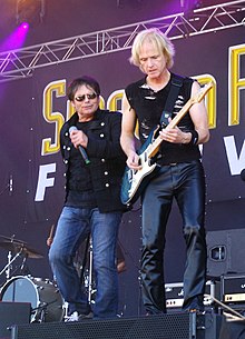 Sullivan (right) with Jimi Jamison at the Sweden Rock Festival in 2013