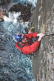 A climber doing the finger jamming technique