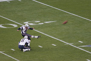 Vinatieri kicking on the field