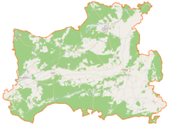 Mapa konturowa powiatu czarnkowsko-trzcianeckiego, u góry nieco na prawo znajduje się punkt z opisem „Parafia pw. św. Jana Chrzciciela w Trzciance”