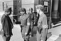 Image 36Ernö Gömbös, (r.) aide-de-camp to Ferenc Szálasi and Gyula Gömbös's son, along with a Honved officer and a member of the Arrow Cross Party, in front of the Ministry of Defense, 1944. (from History of Hungary)