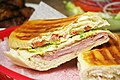 Image 1A Cuban sandwich is a variation of a ham and cheese sandwich that originated among the Cuban workers in the cigar factories in Key West, Florida[1][2]