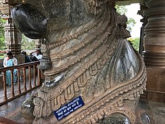 12th-century Nandi jewelry carved in stone at Shaivism Hindu temple Hoysaleswara arts Halebidu Karnataka India.jpg